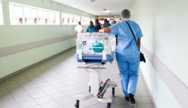 Health care professional in hospital corridor
