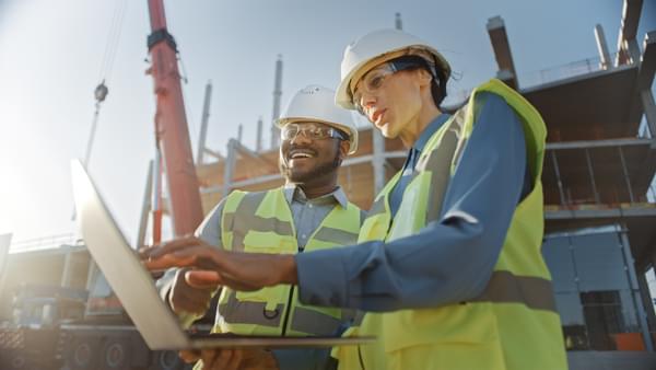 construction workers using laptop 