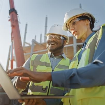 construction workers using laptop 