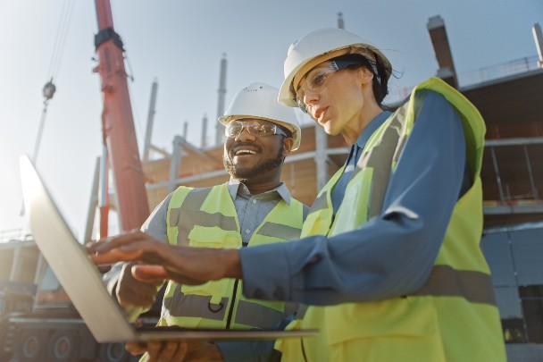 construction workers on laptop 