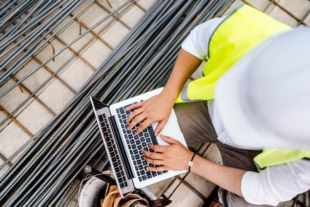 construction worker on laptop