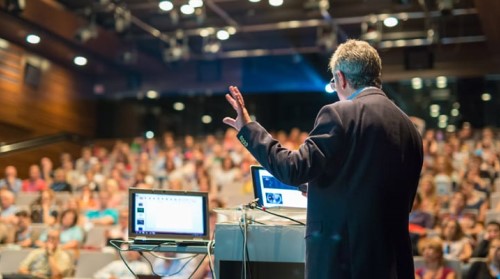 Speaker presenting to a crowd