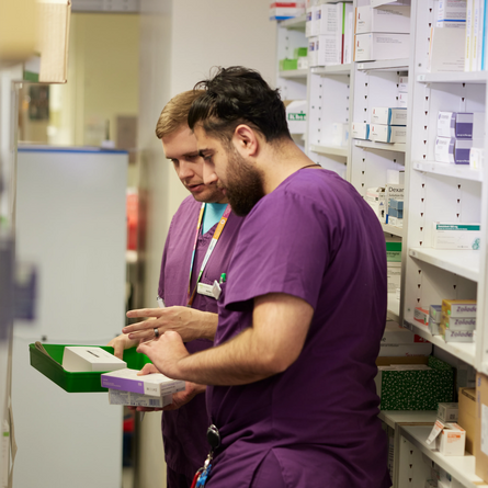 Pharmacists picking medicines in a hospital pharmacy