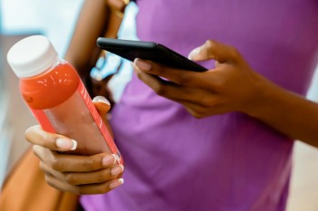 image of person scanning bottle