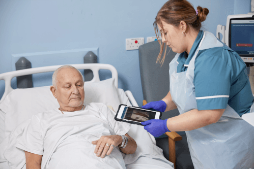 Nurse scanning a patient wristband at the patient bedside