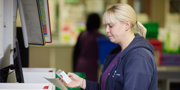 Pharmacist checking a medicine