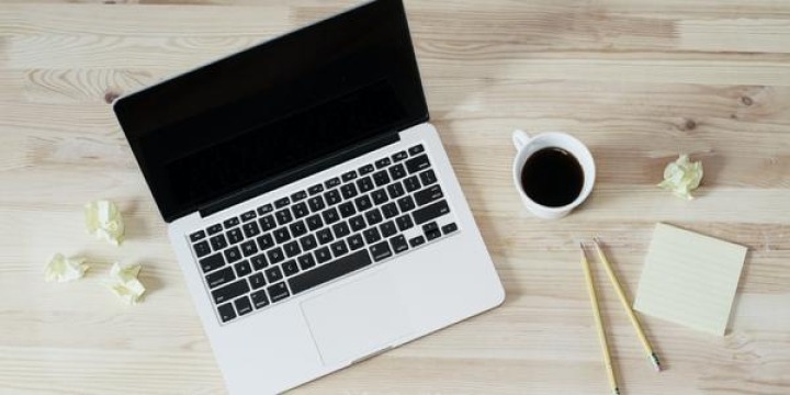 Laptop and coffee on a desk