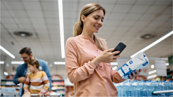 Woman scanning a product's QR code.