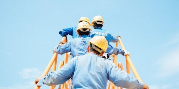 Construction workers on a ladder