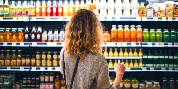 women looking at drinks aisle 